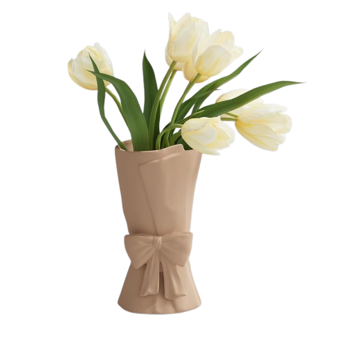 Beige vase with a bow holding white tulips on a white background