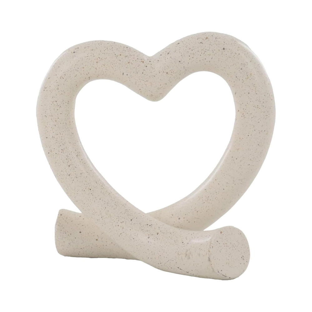 Ceramic heart-shaped object on a white background