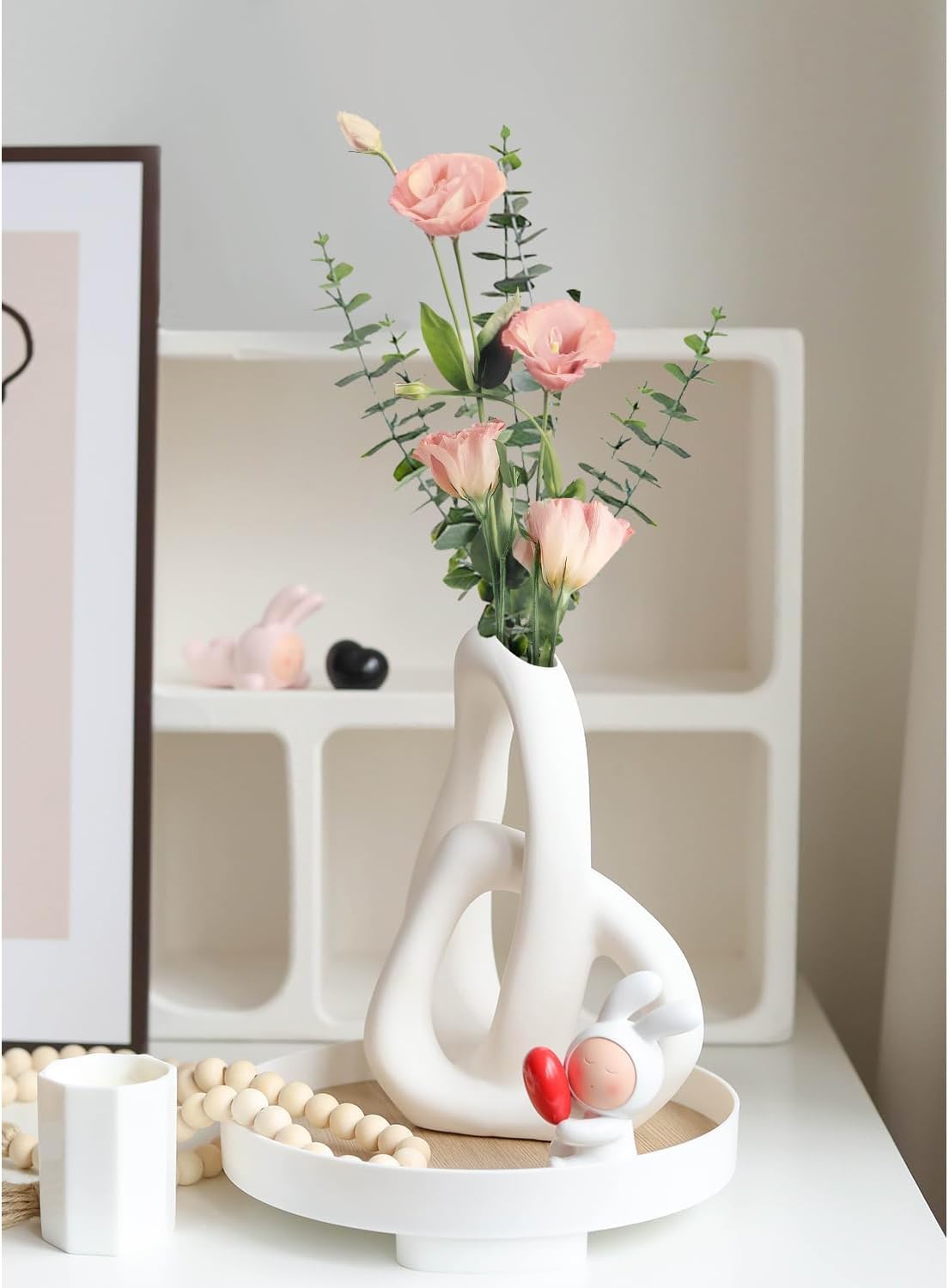 Decorative vase with flowers on a white surface