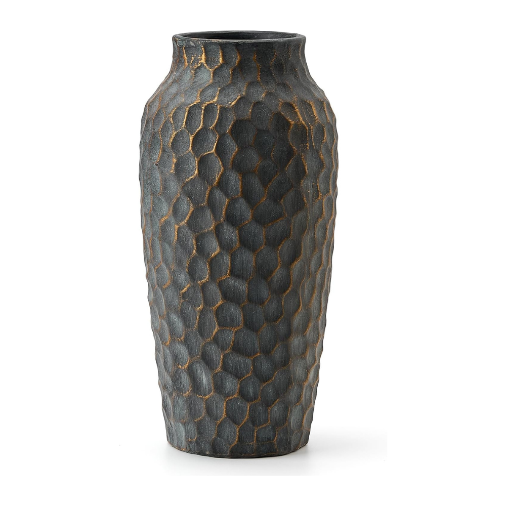 Decorative vase with textured surface on a white background