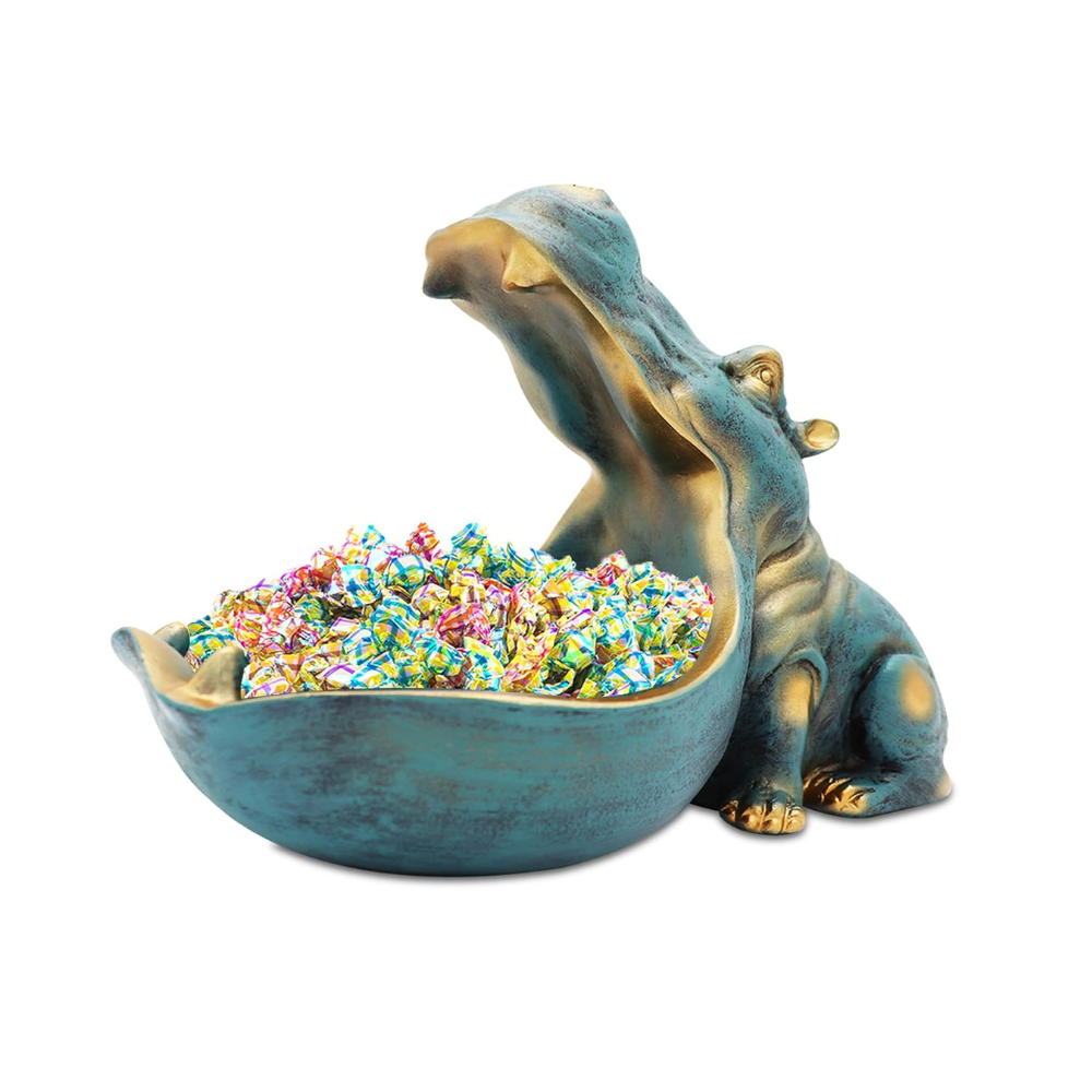 Hippo-shaped bowl filled with colorful candies on a white background