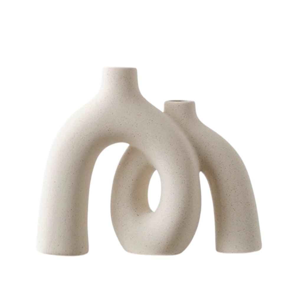 Two beige ceramic vases with a modern, abstract design on a white background