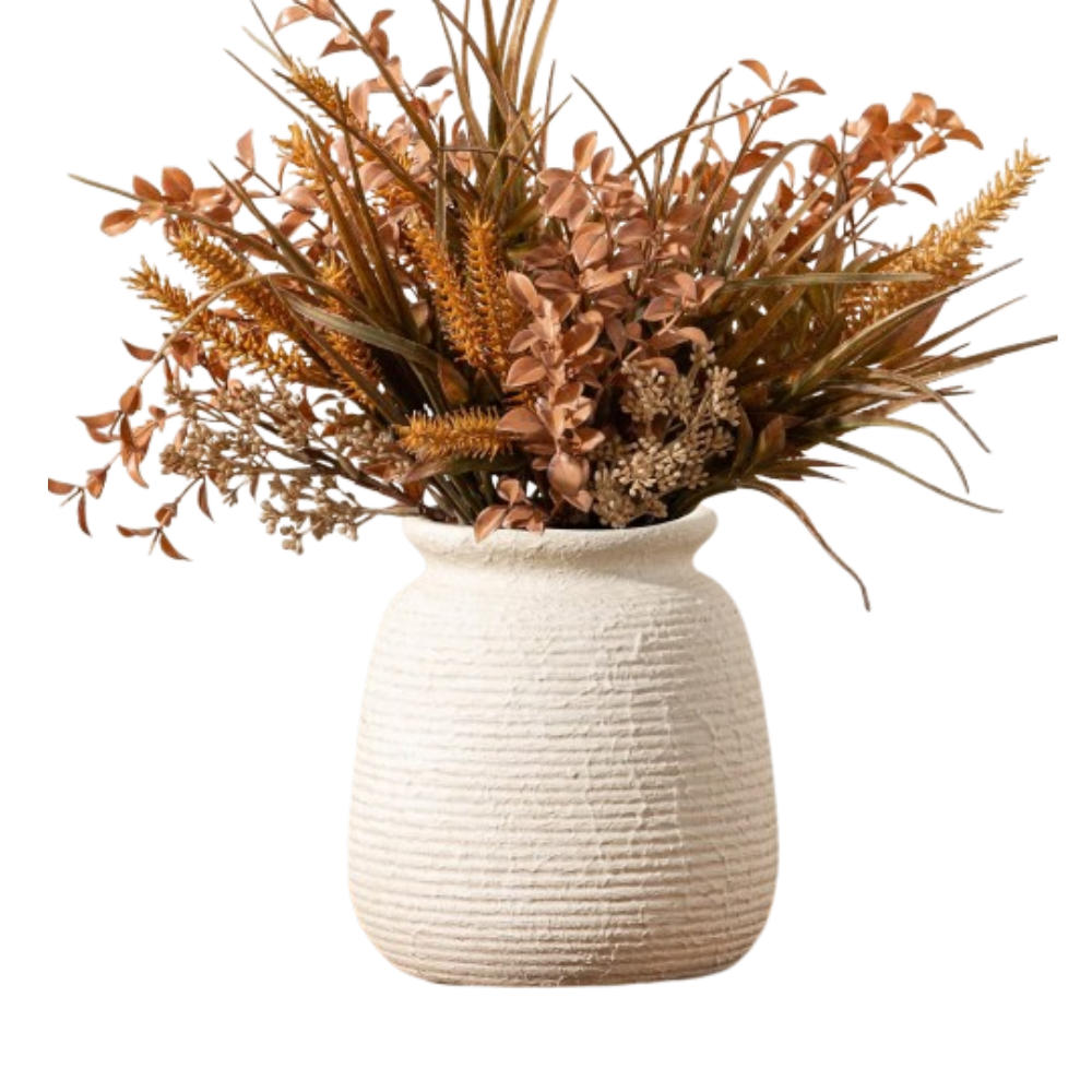 White textured vase with dried plants on a white background